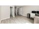 Basement featuring wood floors, desk, stairway, and a door to the bathroom at 5302 E 46Th St, Indianapolis, IN 46226