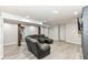 Finished basement offering flexible living space with wood floors and comfortable seating at 5302 E 46Th St, Indianapolis, IN 46226