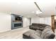Finished basement features recessed lighting, wood floors, fireplace and comfortable seating at 5302 E 46Th St, Indianapolis, IN 46226