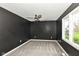 This bedroom features a new carpet, ceiling fan and view to the backyard at 5302 E 46Th St, Indianapolis, IN 46226