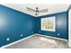 This bedroom features a new carpet, ceiling fan and view to the backyard at 5302 E 46Th St, Indianapolis, IN 46226