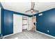 This bedroom features a new carpet, ceiling fan, and access to an adjacent closet at 5302 E 46Th St, Indianapolis, IN 46226