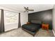 This bedroom features a modern accent wall, ceiling fan and two side tables at 5302 E 46Th St, Indianapolis, IN 46226