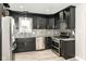 Modern kitchen featuring stainless steel appliances, stylish backsplash, and granite countertops at 5302 E 46Th St, Indianapolis, IN 46226