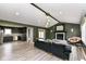 The living room has an open concept with modern furnishings, a fireplace, and luxury vinyl flooring at 5302 E 46Th St, Indianapolis, IN 46226