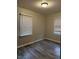 Comfortable bedroom with two windows providing natural light, complemented by neutral walls at 5428 Speedway Dr, Indianapolis, IN 46224