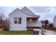 Charming single-story home featuring white siding, a cozy porch, and a well-maintained front lawn at 5428 Speedway Dr, Indianapolis, IN 46224