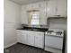 Functional kitchen featuring white cabinets, double basin sink and a range at 5428 Speedway Dr, Indianapolis, IN 46224