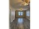 Spacious living room with ceiling fans and ample natural light from the windows at 5428 Speedway Dr, Indianapolis, IN 46224