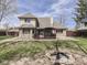 Brick home features a backyard with a stone fire pit and a deck with a gazebo at 5461 Steven Dr, Greenwood, IN 46142