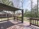 View of a backyard from a covered patio, showcasing the fenced yard and mature trees at 5461 Steven Dr, Greenwood, IN 46142