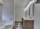 Bright bathroom featuring a jacuzzi tub, double vanity, and neutral wall paint at 5461 Steven Dr, Greenwood, IN 46142