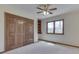 Bedroom with a ceiling fan, a window offering ample natural light, and built-in shelving at 5461 Steven Dr, Greenwood, IN 46142