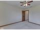 Neutral bedroom with plush carpeting, warm wood trim, and a view into the hall at 5461 Steven Dr, Greenwood, IN 46142