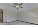 Empty carpeted bedroom featuring a ceiling fan and baseboard trim at 5461 Steven Dr, Greenwood, IN 46142