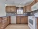 Eat-in kitchen with stainless steel appliances, wood cabinets, and hardwood floors at 5461 Steven Dr, Greenwood, IN 46142