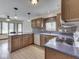 Eat-in kitchen with stainless steel appliances, wood cabinets, and hardwood floors at 5461 Steven Dr, Greenwood, IN 46142