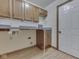 Laundry room with countertops and cabinets with washer and dryer hookups at 5461 Steven Dr, Greenwood, IN 46142
