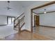 Bright living room featuring a staircase, wood trim, and a view to the deck at 5461 Steven Dr, Greenwood, IN 46142