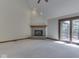 Bright living room with fireplace, vaulted ceiling, and sliding glass door to a deck at 5461 Steven Dr, Greenwood, IN 46142