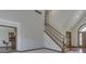 Open living room area with staircase, and an adjacent kitchen at 5461 Steven Dr, Greenwood, IN 46142