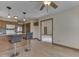 Open living space with breakfast bar, hardwood floors, and ample lighting at 5461 Steven Dr, Greenwood, IN 46142