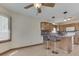 Open living space showcasing a breakfast bar, hardwood floors, and window at 5461 Steven Dr, Greenwood, IN 46142