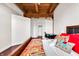 Bedroom with rustic wooden beams, modern decor, and hardwood floors for a vintage yet contemporary living space at 55 S Harding St # 301, Indianapolis, IN 46222