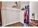 Walk-in closet with white wire shelves, storage for personal items, and an updated lighting fixture at 55 S Harding St # 301, Indianapolis, IN 46222