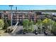 Brick exterior of the H. Lauter Lofts, featuring private balconies and a reserved parking at 55 S Harding St # 301, Indianapolis, IN 46222