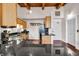 Modern kitchen with stainless steel appliances, wood cabinets and wood-beamed ceiling at 55 S Harding St # 301, Indianapolis, IN 46222