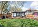 Well-maintained backyard with wood fence, patio, and lawn, perfect for outdoor living at 5619 Carrollton Ave, Indianapolis, IN 46220