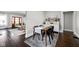 Inviting dining room featuring hardwood floors and stylish decor with a cozy rug and curated wall art at 5619 Carrollton Ave, Indianapolis, IN 46220