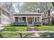 Charming single Gathering home with a well maintained lawn and inviting front porch at 5619 Carrollton Ave, Indianapolis, IN 46220