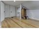 Attic space featuring hardwood floors, a unique dresser, and bonus storage space at 57 Worman St, Indianapolis, IN 46227