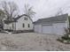 Backyard view of home and detached garage, patio seating, and ample space at 57 Worman St, Indianapolis, IN 46227