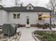 Charming backyard with patio seating, mature trees, and landscaped flower beds at 57 Worman St, Indianapolis, IN 46227