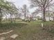 Expansive backyard featuring mature trees and plenty of space for outdoor activities at 57 Worman St, Indianapolis, IN 46227