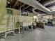 Spacious basement with a vintage sink, ladder, and ample storage space at 57 Worman St, Indianapolis, IN 46227