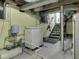 Unfinished basement area with laundry, storage, utilities, and access to stairs at 57 Worman St, Indianapolis, IN 46227