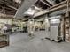 Functional basement space with exposed ductwork, supports, and a concrete floor at 57 Worman St, Indianapolis, IN 46227