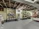 Unfinished basement with ample shelving and storage space for organization and convenience at 57 Worman St, Indianapolis, IN 46227