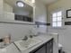 Bathroom featuring a classic black and white tile scheme and a traditional vanity at 57 Worman St, Indianapolis, IN 46227