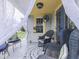 Inviting covered porch with comfortable seating, ceiling fan, and sheer curtains at 57 Worman St, Indianapolis, IN 46227
