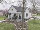 Charming single-Gathering home with a covered porch, manicured lawn, and mature trees at 57 Worman St, Indianapolis, IN 46227
