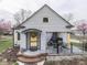 Charming home featuring a covered porch and colorful accents, creating a welcoming entrance at 57 Worman St, Indianapolis, IN 46227