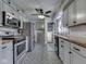 An updated kitchen with stainless steel appliances and modern tile flooring at 57 Worman St, Indianapolis, IN 46227