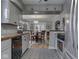 Charming kitchen with gray cabinets, modern appliances, and a view into the dining area at 57 Worman St, Indianapolis, IN 46227