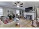 Comfortable living room with hardwood floors, a decorative fireplace, and plenty of natural light at 57 Worman St, Indianapolis, IN 46227