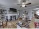 Bright living room featuring a decorative fireplace, hardwood floors, and ample seating at 57 Worman St, Indianapolis, IN 46227